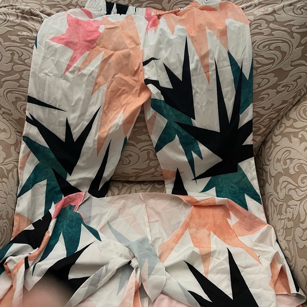 Never worn two pieces pant and short sleeve top set